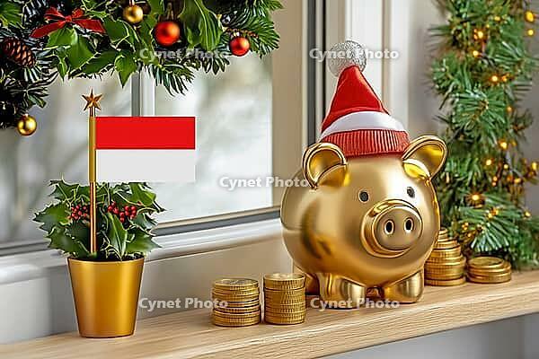 Flag of Indonesia on a potted holly plant and golden piggy bank with hat and coins, sorrounded by festive decorations during Christmas holiday season.Business, finance and economy concept, AI generated [IBR123622511]