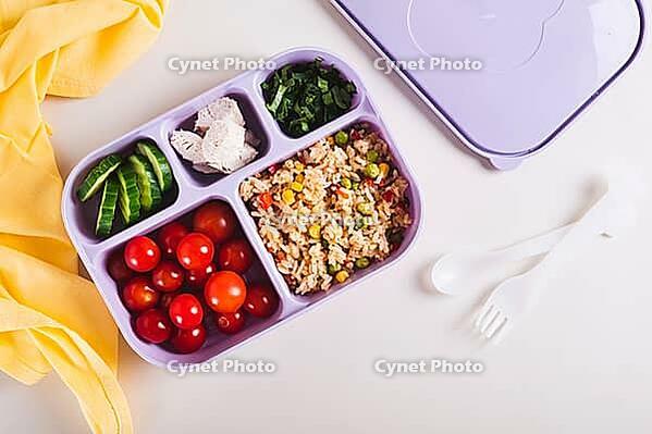 Homemade lunchbox with meat, vegetables and cereals for lunch at work on the table top view [IBR123629686]