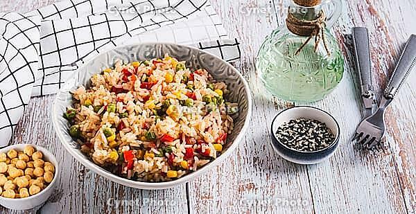 Homemade fried rice with peas, corn and pepper in a bowl on the table web banner [IBR123629688]
