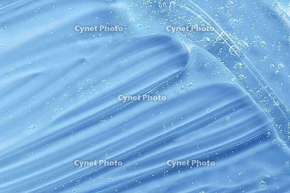 Transparent beauty korean cosmetic serum. Hand sanitizer gel texture smear smudge swatch with bubble. Blue moisturizing cleanser hair gel sample. Skincare makeup cream. Skin care liquid splash product [IBR123646463]