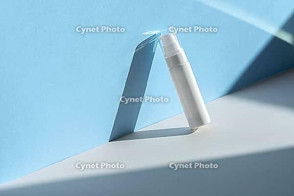 Beauty product mockup. Wellness packaging. Cream bottle, moisturizing lotion, mousse, cleanser, shampoo for skincare routine. Cosmetic on blue shadow background. Branding spa [IBR123646472]