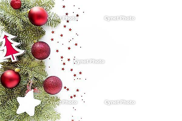 Christmas composition with decoration. Christmas balls, wooden tree, star, fir branches on white surface. Flat lay, top view, copy space, above [IBR123646484]