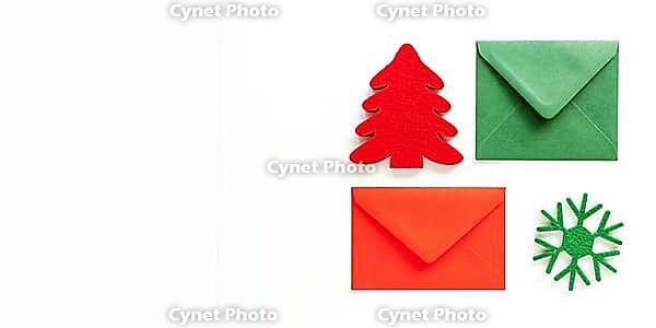 Set of christmas envelopes and felt decoration on white. Banner design, top view, flat lay, copy space [IBR123646488]