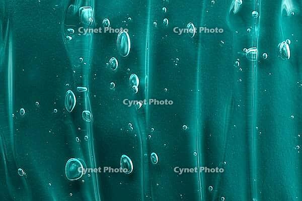 Green gel texture smear with bubble. Transparent beauty serum cosmetic product. Skincare cleanser smudge. Abstract cosmetic texture background. Tidewater green trendy texture [IBR123646489]