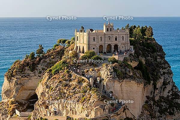 Tropea, Italy - 27.07.2023: Medieval monastery in Byzantine style, located on steep rocky cliff overlooking the sea. Sanctuary of Santa Maria dell'Isola di Tropea [IBR123646521]