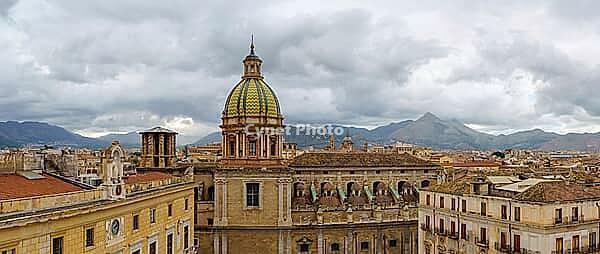 Palermo, Italy - 06.11.2022: Stunning panorama of Church of San Giuseppe dei Padri Teatini, Palermo cityscape with historical architecture and mountains in the background [IBR123646527]