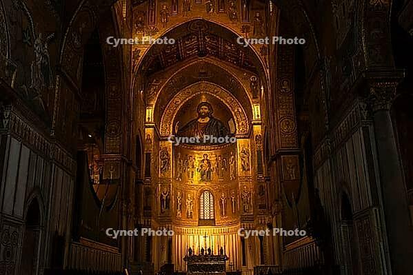 Monreale, Italy - 04.11.2022: Majestic church interior with illuminated altar and religious art in historic cathedral [IBR123646529]