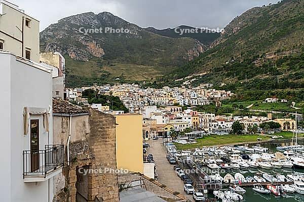 Castellammare del Golfo, Italy - 05.11.2022: Picturesque coastal town with marina and mountain views [IBR123646545]