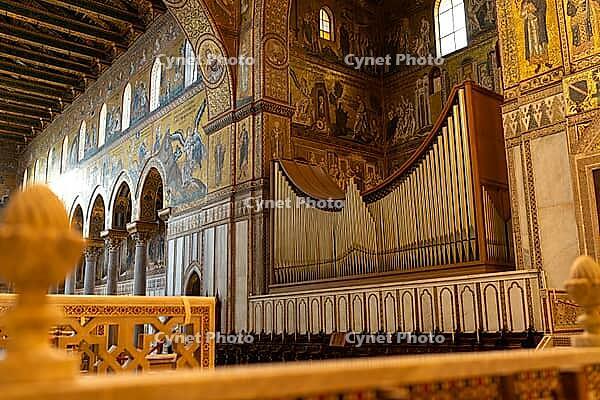 Monreale, Italy - 04.11.2022: Majestic pipe organ in ornate cathedral interior with stunning mosaics [IBR123646556]