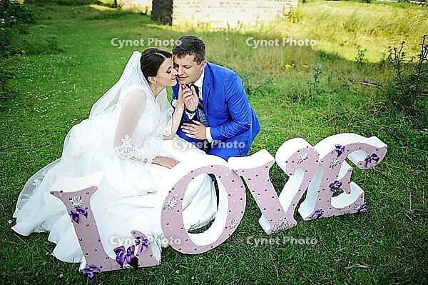 Wedding couple with love words [IBR123675086]