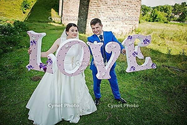 Wedding couple with love words [IBR123675087]