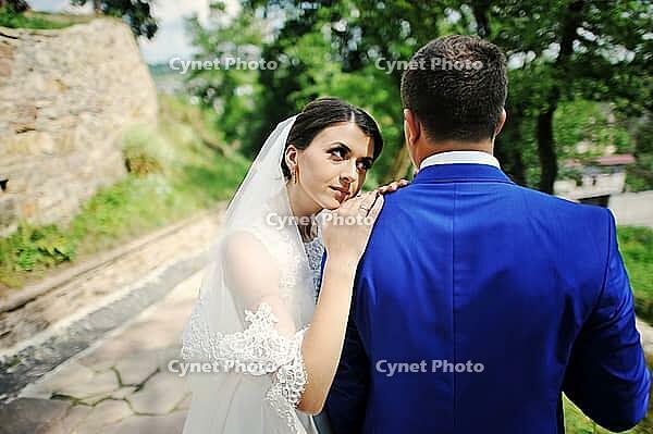 Young wedding couple in love on their wedding day [IBR123675092]