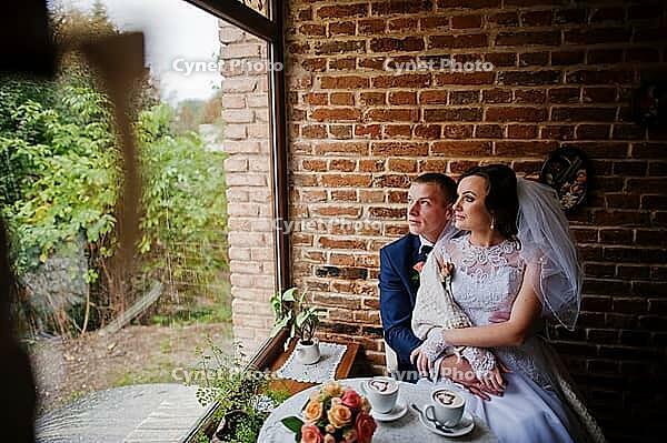Wedding couple at vintage cafe at autumn day [IBR123675102]