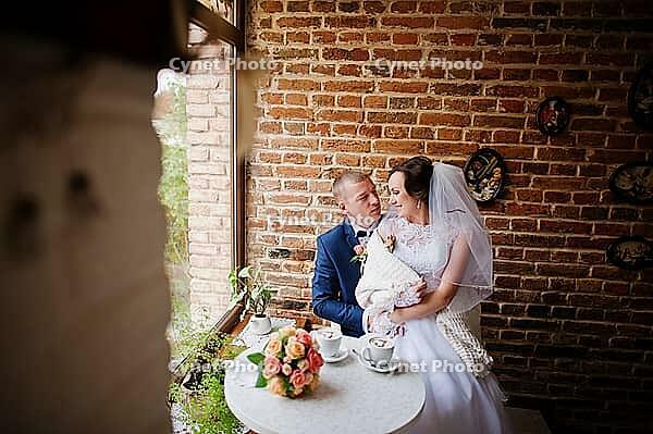 Wedding couple at vintage cafe at autumn day [IBR123675109]