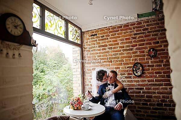 Wedding couple at vintage cafe at autumn day [IBR123675112]