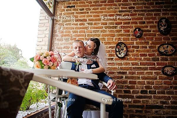 Wedding couple at vintage cafe at autumn day [IBR123675114]