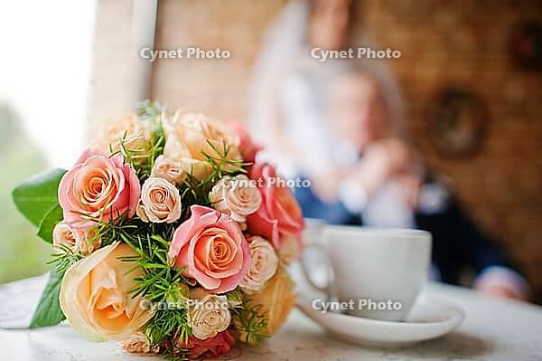 Wedding bouquet at vintage cafe background newlywed [IBR123675117]