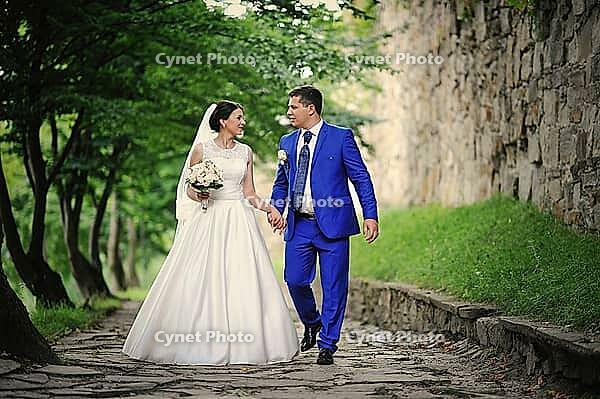 Young wedding couple in love on their wedding day [IBR123675128]