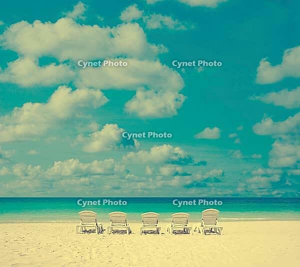 Concept photo of beach with chair in vintage toned [IBR123713351]