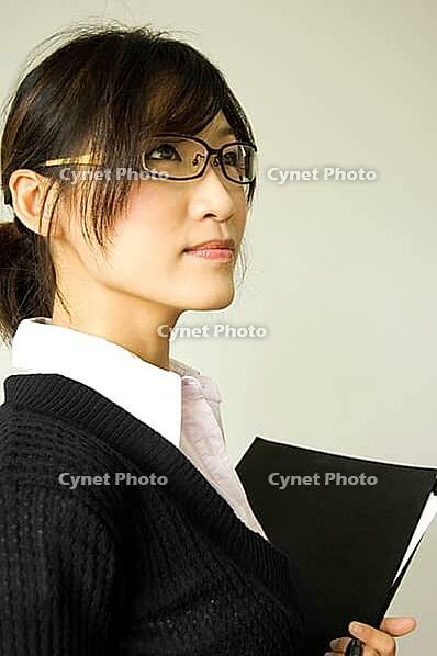 Young women holding a file [IBR123713358]