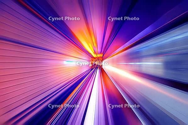 Fast train passing in a neon light tunnel [IBR123713379]