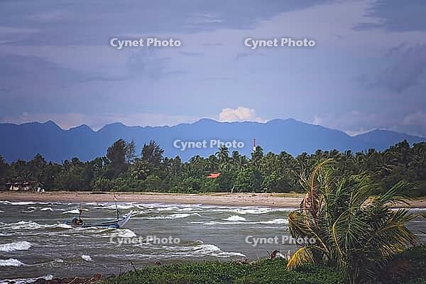Fisherman returning to the beach after days work on a rough seas on the coast of Sumatra Island, Indonesia, Asia [IBR123713381]
