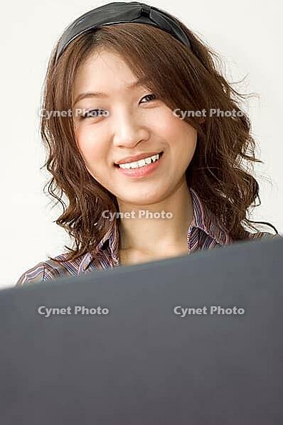 Asian business women working with laptop [IBR123713388]
