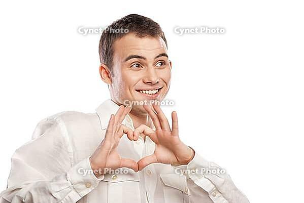 Portrait of happy man making heart from his hands on white background [IBR123723165]