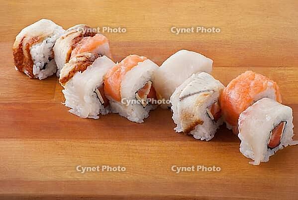 Traditional Japanese food Sushi. Closeup japanese sushi on wooden plate [IBR123723194]