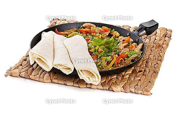Traditional mexican beef fajitas with tortillas on white background [IBR123723195]