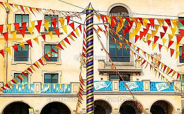 Johannesburg, South Africa - September 22, 2012: Bunting flags strung up to a central pole at outdoor funfair [IBR123723290]