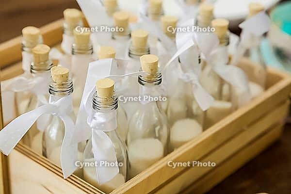 Small ornamental jars with cork tops and ribbons for display purposes [IBR123723292]