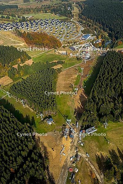 View the ski lifts in front of next season in Winterberg, Winterberg, Hochsauerland, North Rhine-Westphalia, Germany, Europe, aerial view, birds-eyes view, aerial photography, aerial photography, overview, overview, bird's eye view [IBR112876050]