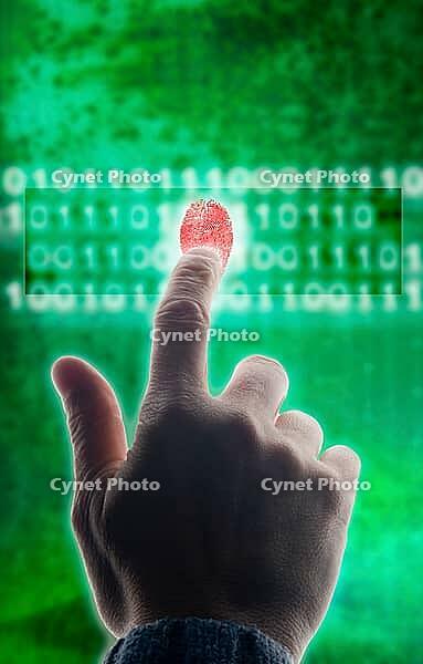 A hand with a fingerprint touching a virtual binary code interface in ...