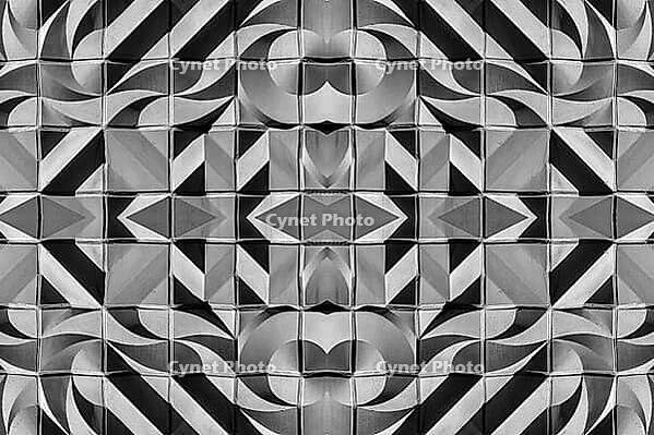 Abstract photography with symmetrical, abstract patterns that consist of sharp geometric and wavy shapes in shades of black, white and gray [IBR123760815]