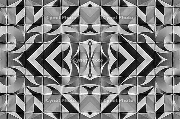 Abstract photography with symmetrical, abstract patterns that consist of sharp geometric and wavy shapes in shades of black, white and gray [IBR123760817]