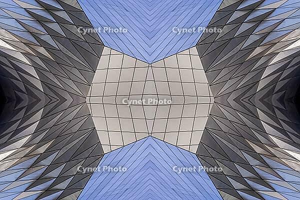 Abstract photography with a symmetrical, diamond-shaped shape that consists of repetitive lines and surfaces in shades of gray, white and blue and creates an impression of rhythm, depth and cool geometric harmony [IBR123760827]