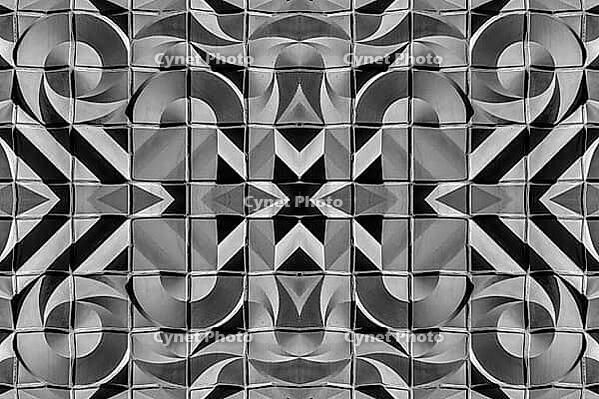 Abstract photography with symmetrical, abstract patterns that consist of sharp geometric and wavy shapes in shades of black, white and gray [IBR123760830]