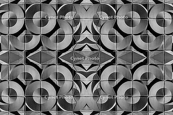 Abstract photography with symmetrical, abstract patterns that consist of sharp geometric and wavy shapes in shades of black, white and gray [IBR123760831]