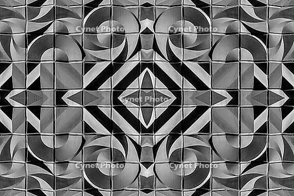 Abstract photography with symmetrical, abstract patterns that consist of sharp geometric and wavy shapes in shades of black, white and gray [IBR123760832]