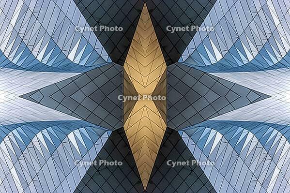 Abstract photography with symmetrical, sharp geometric forms of architecture in cool shades of gray and blue as well as warm beige, emphasizing the contrast of light, shadow and structure [IBR123760839]