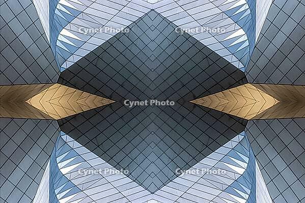 Abstract photography with symmetrical, sharp geometric forms of architecture in cool shades of gray and blue as well as warm beige, emphasizing the contrast of light, shadow and structure [IBR123760842]