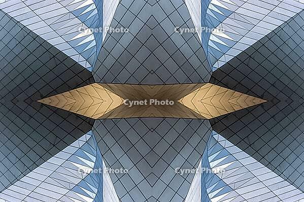 Abstract photography with symmetrical, sharp geometric forms of architecture in cool shades of gray and blue as well as warm beige, emphasizing the contrast of light, shadow and structure [IBR123760843]