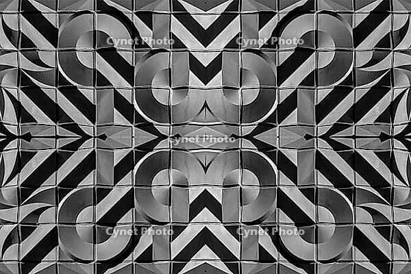 Abstract photography with symmetrical, abstract patterns that consist of sharp geometric and wavy shapes in shades of black, white and gray [IBR123760844]