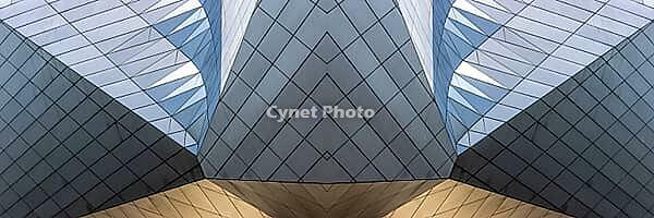 Abstract photography with symmetrical, sharp geometric forms of architecture in cool shades of gray and blue as well as warm beige, emphasizing the contrast of light, shadow and structure [IBR123760845]