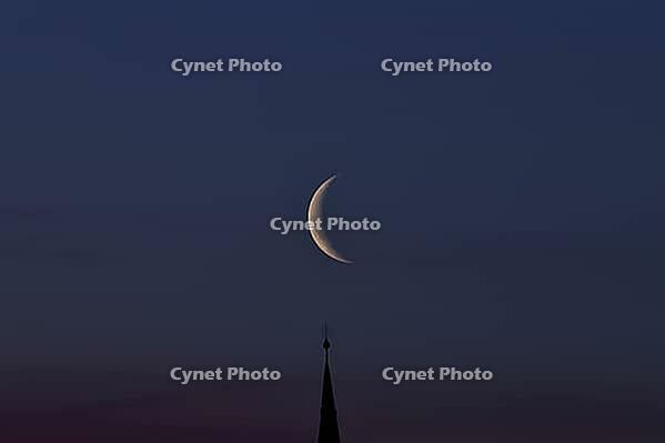 Crescent moon with waning moon over the spire of the pilgrimage church of St. Aegidius in Schildthurn, dawn, dawn, Lower Bavaria, Bavaria, Germany [IBR123760849]