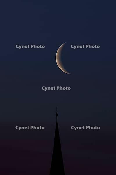 Crescent moon with waning moon over the spire of the pilgrimage church of St. Aegidius in Schildthurn, dawn, dawn, Lower Bavaria, Bavaria, Germany [IBR123760850]