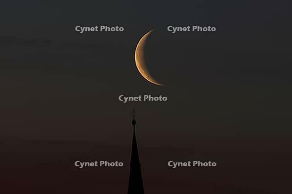 Crescent moon with waning moon over the spire of the pilgrimage church of St. Aegidius in Schildthurn, dawn, dawn, Lower Bavaria, Bavaria, Germany [IBR123760852]