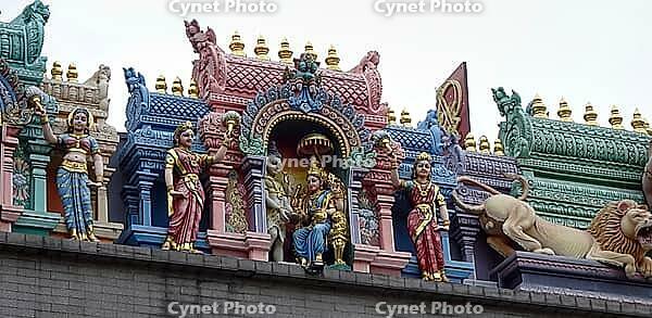 Detailed figures in bright colors on temple roof, Singapore, Singapore [IBR123769647]
