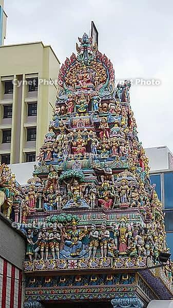 Detailed sculptures on a Hindu temple with rich colors, Singapore, Singapore [IBR123769649]